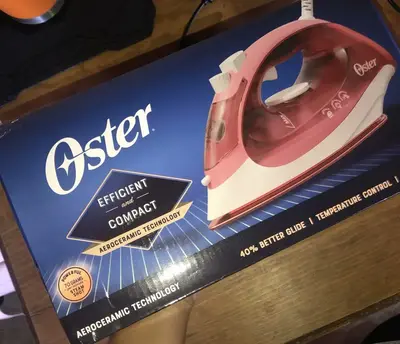 foto de Ferro de Passar a Vapor 220v Oster Rosa GCSTBS5053-057
