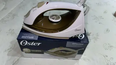 foto de Ferro de Passar GCSTBS5907 Antiaderente Com Jato De Vapor e Potência De 1200W Cor Champagne Oster
