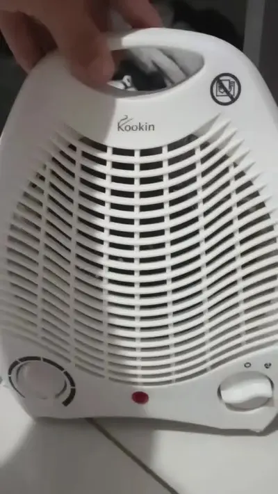 foto de Aquecedor De Ar Kookin Kna1500 Elétrico Termoventilação 1500w Com Proteção Contra Tombamento Branco
